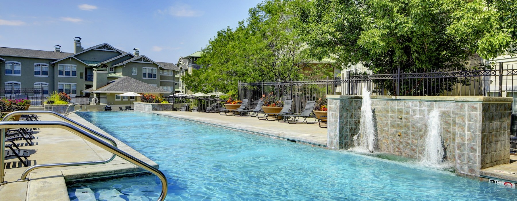 a pool with a building in the background