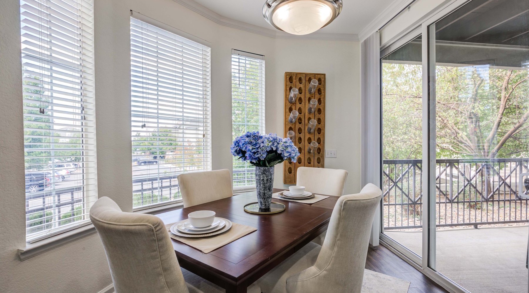 Relax and unwind in stylish living spaces a dining room with a table and chairs