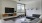 a clubhouse room with a tv and couches